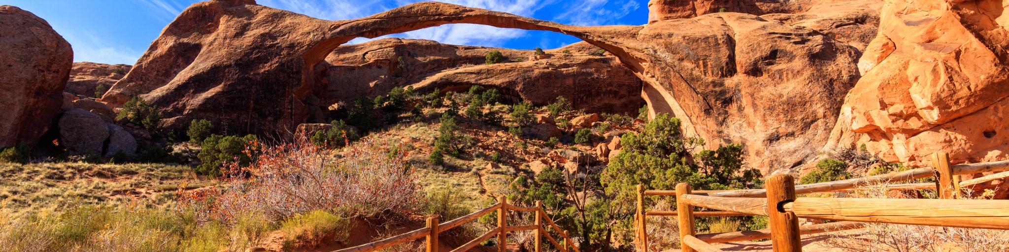 A beautiful pathway leading through the natural beauty of Arches National Park in Utah.