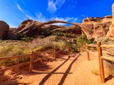 A beautiful pathway leading through the natural beauty of Arches National Park in Utah.