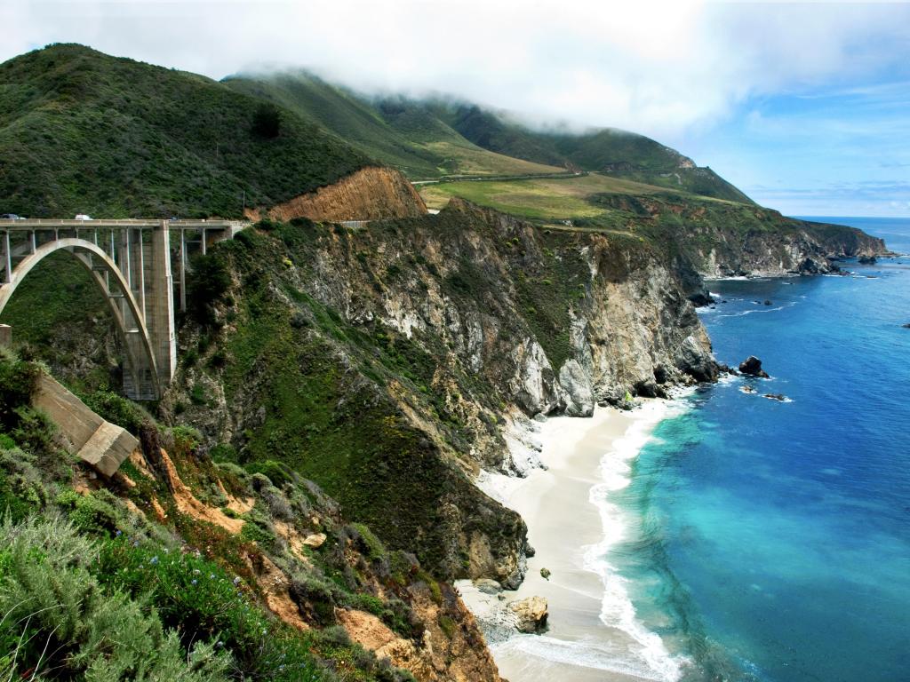 The Pacific shoreline at Bixby Creek Bridge near Big Sur with the beach below the towering bridge