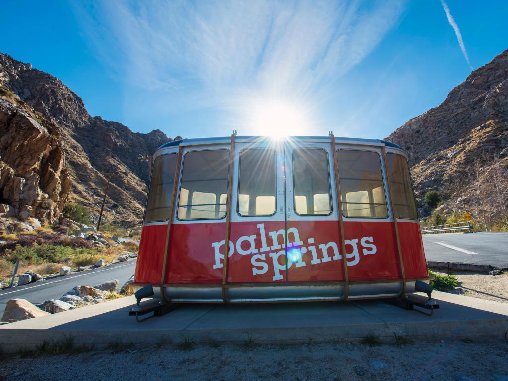 Bright red aerial car with Palm Springs signage, part of from Palm Springs Aerial Tramway California