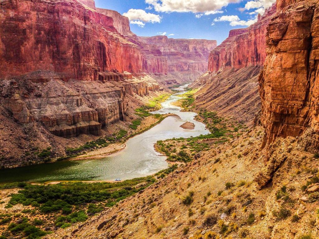 Grand Canyon, Arizona, USA with a Colorado River view and boats from Nankoweap Delta on a sunny day.