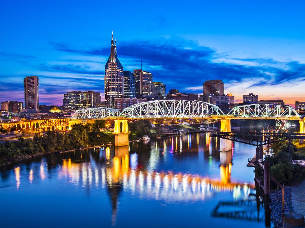 Nashville, Tennessee, USA with the downtown skyline at Shelby Street Bridge at night.