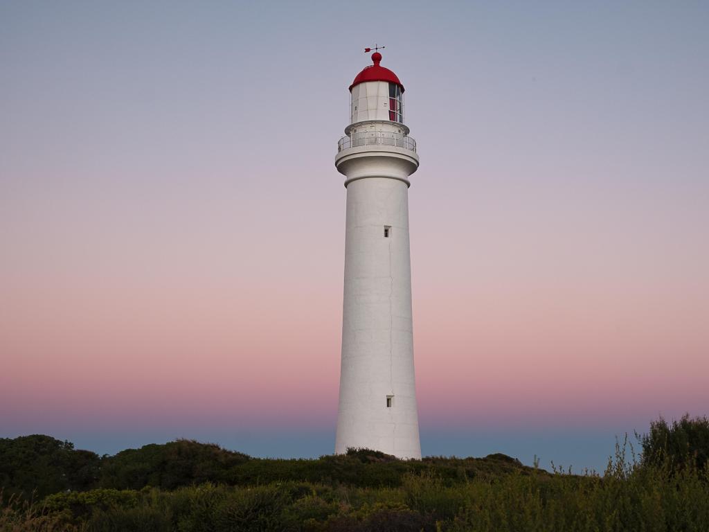 Close up of Split Point Lighthouse at sunset on the coastline of Australia