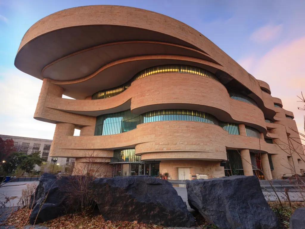Organic circular shaped museum building during a soft sunset