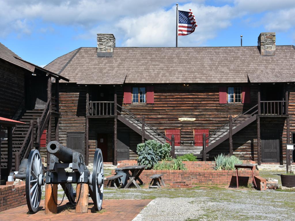 Renovated old fort, now a tourist attraction, with a cannon in the foreground