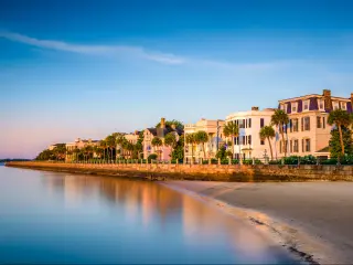 The historic homes near the sea, the Battery in Charleston with beautiful landscape and trees in a clear blue sky morning, South Carolina