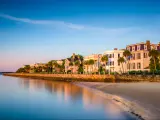 The historic homes near the sea, the Battery in Charleston with beautiful landscape and trees in a clear blue sky morning, South Carolina