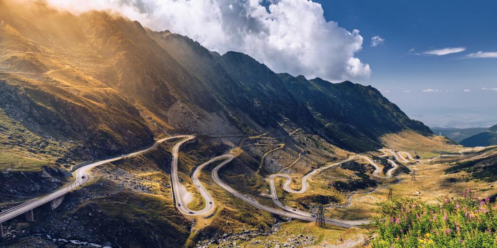 The snaking Transfagarasan pass, Romania, on a sunny summer's day, with the Carpathian mountains in the background.