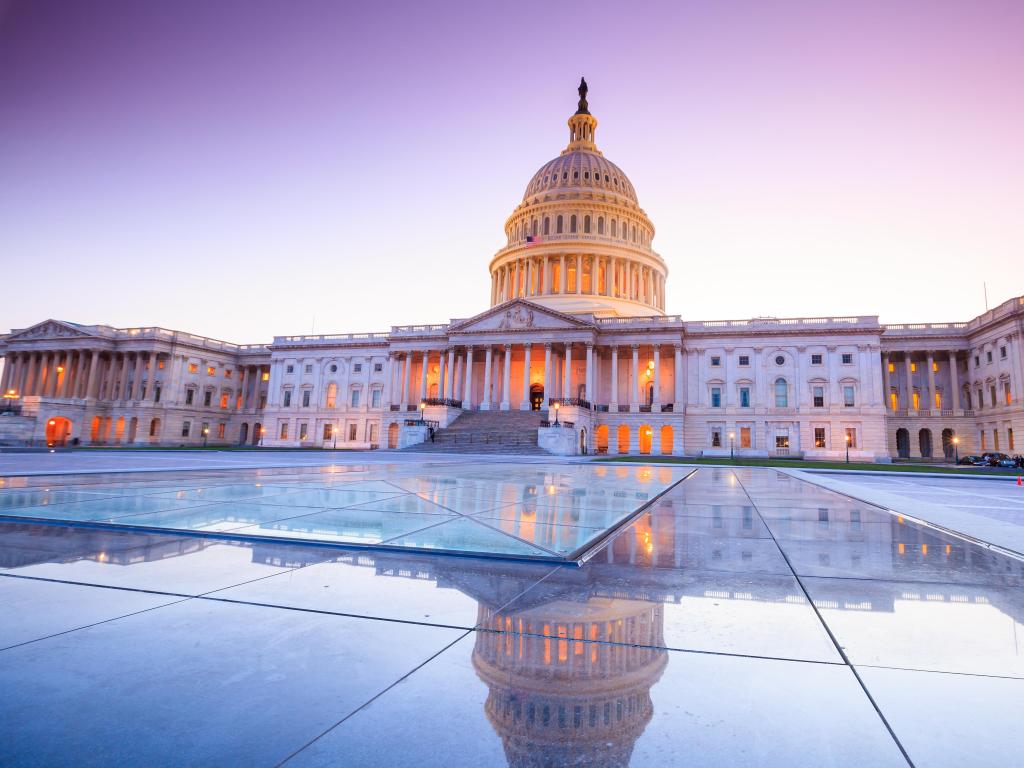 Washington DC, Washington, USA taken at the United States Capitol building with the dome lit up at night.