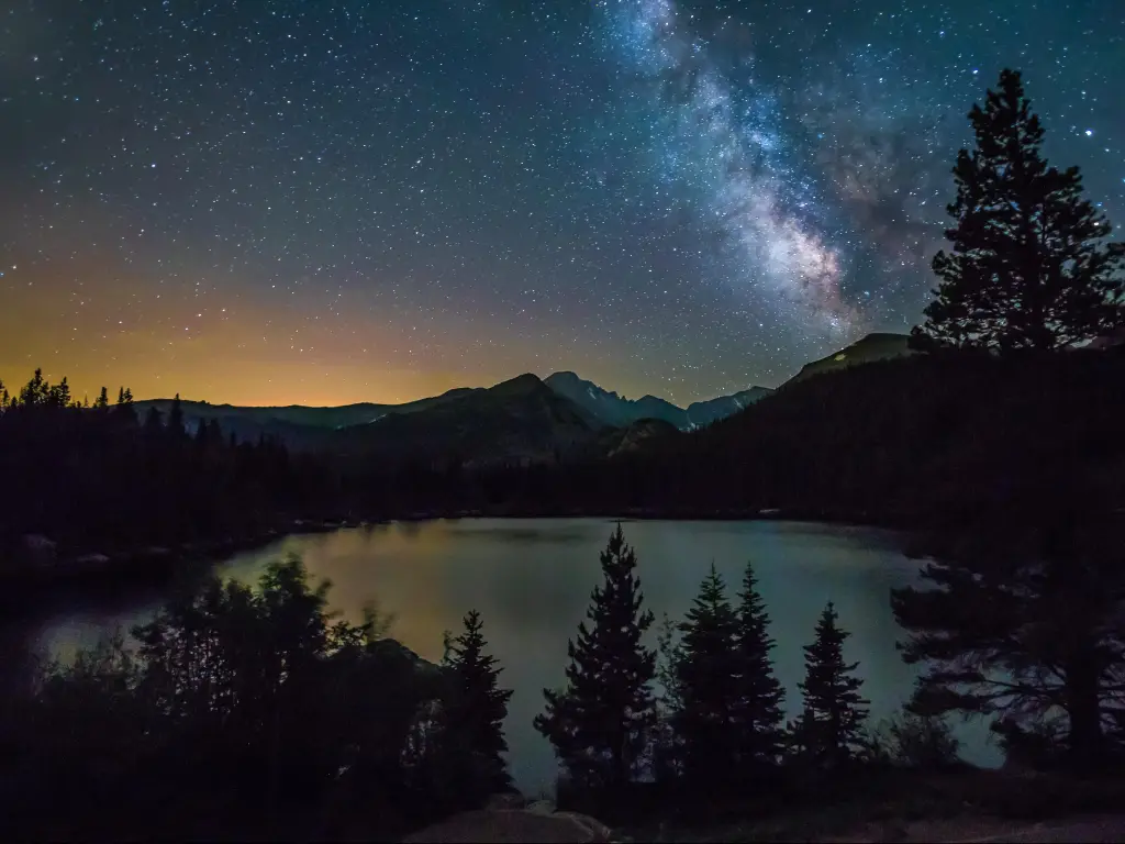 The Milky Way rising above Longs Peak and Bear Lake in Rocky Mountain National Park.