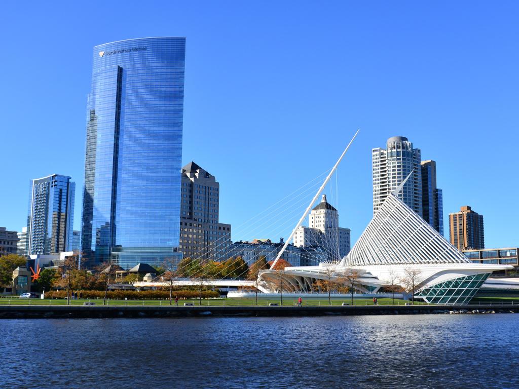 The Calatrava designed architecture of the Milwaukee Art Museum with the Northwestern Mutual building filling the sky in this cityscape.