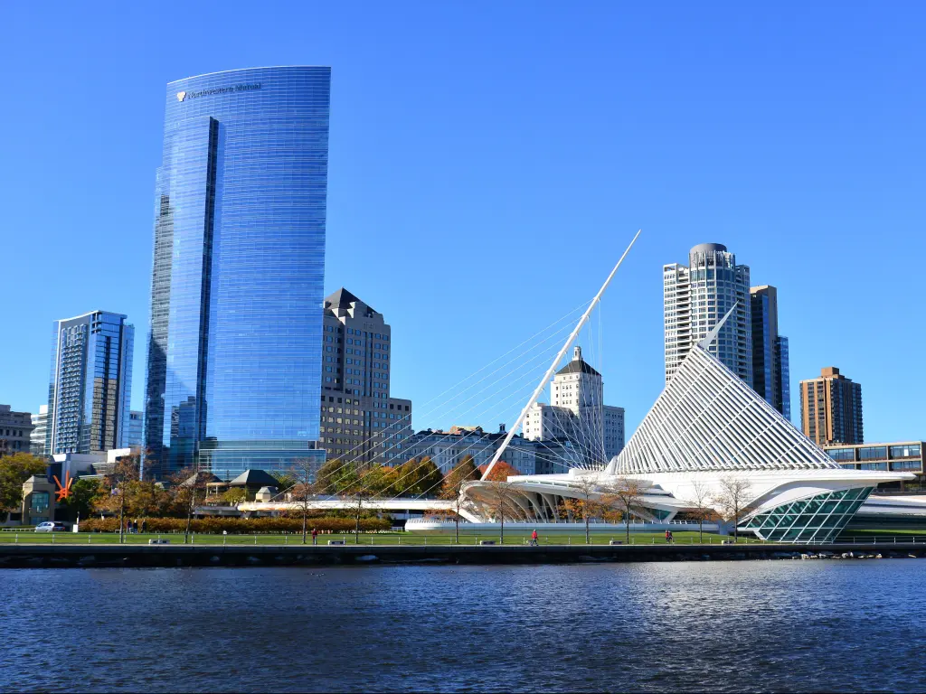 The Calatrava designed architecture of the Milwaukee Art Museum with the Northwestern Mutual building filling the sky in this cityscape.