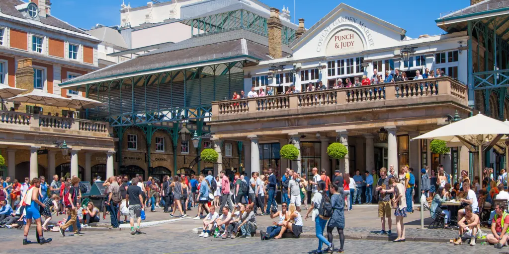 People milling around the entrance to Covent Garden market 