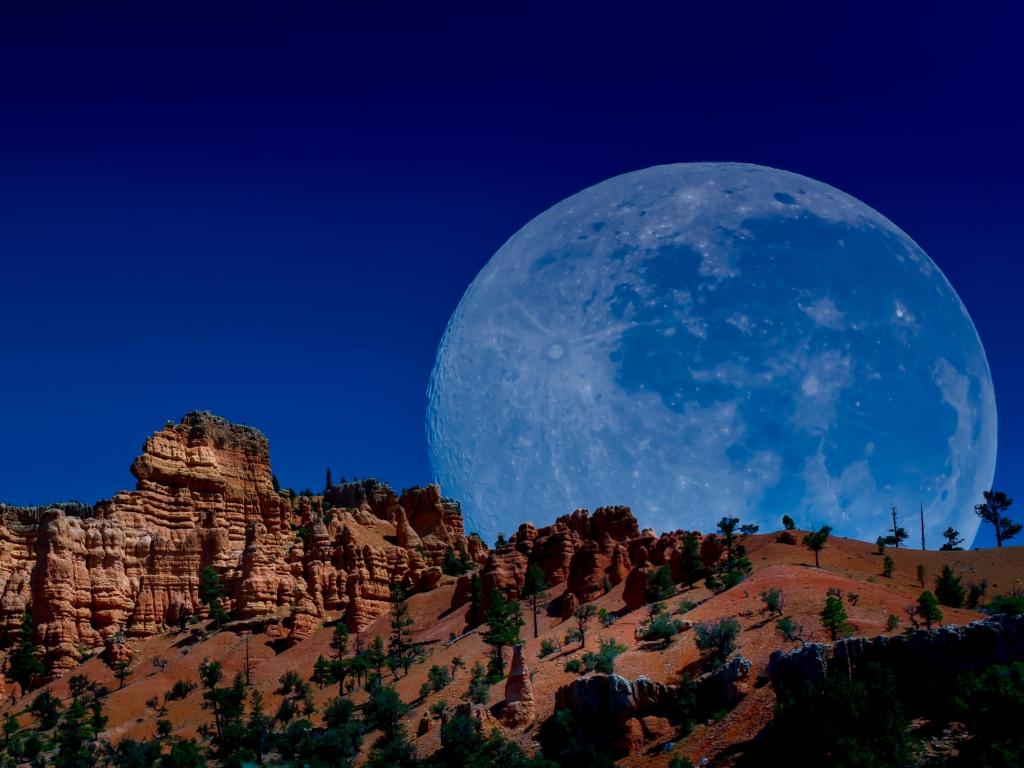 Bryce Canyon Super Moon rises over Bryce Canyon's sandstone canyons to create a dramatic western landscape.