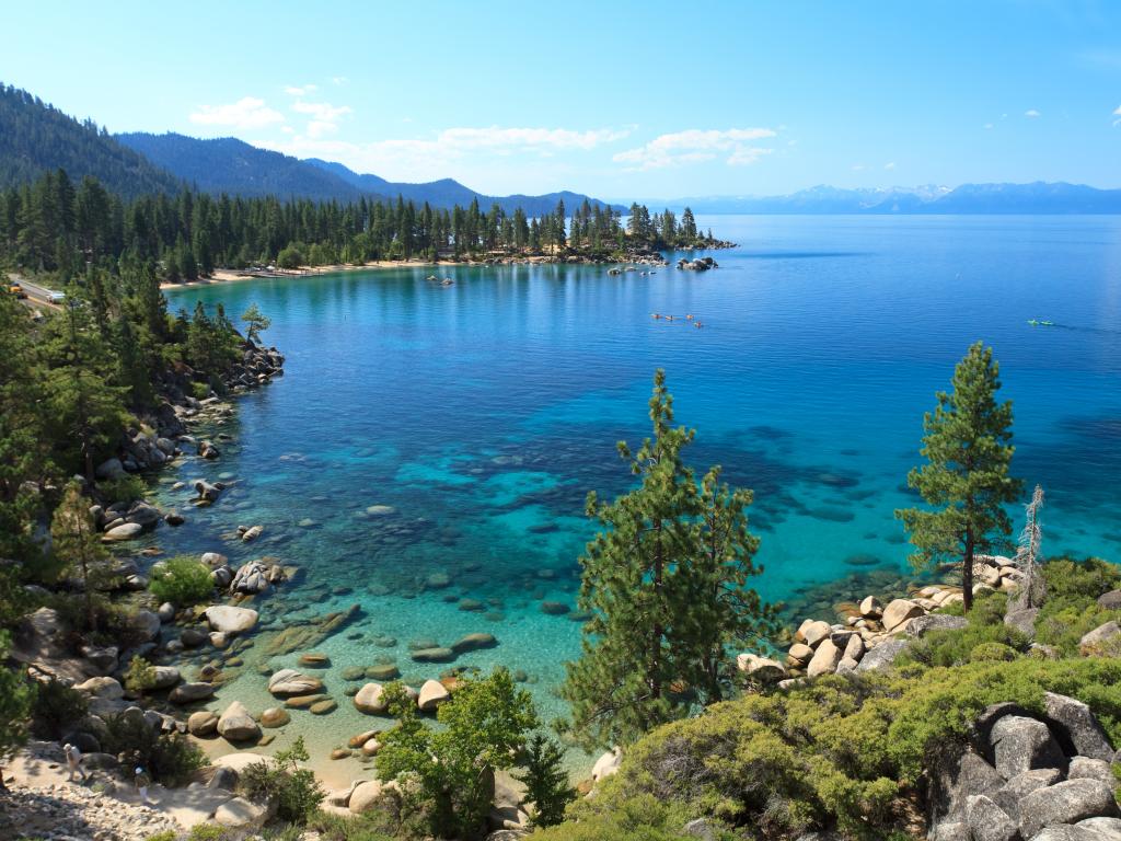 Crystal clear still waters and boulder beach of Lake Tahoe in California