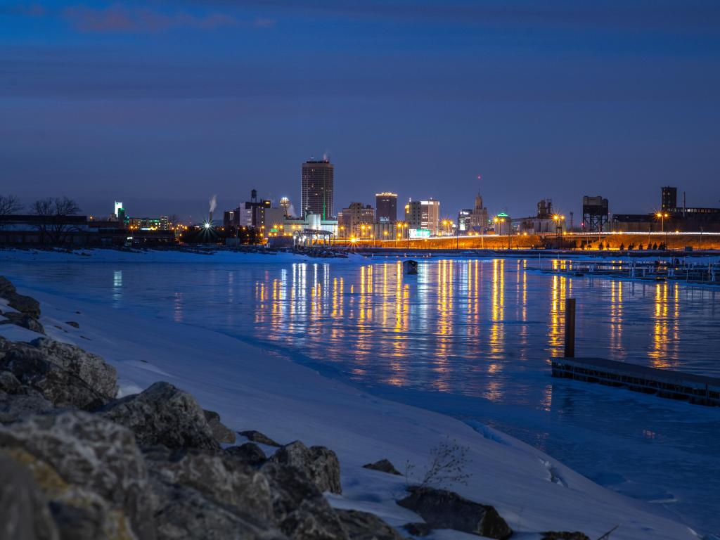 Buffalo, New York, USA with a view of downtown Buffalo skyline from different perspective with a view of the Erie Basin Marina taken at night.