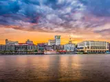 Savannah, Georgia, USA skyline on the Savannah River at dusk.
