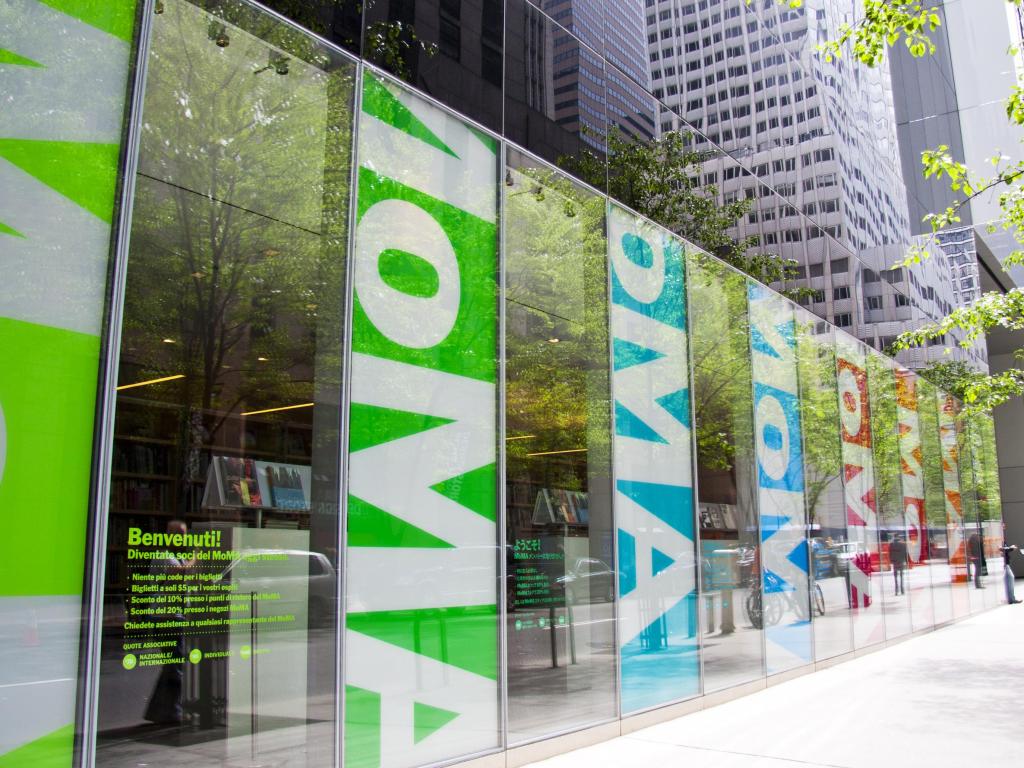 Museum of Modern Art Design building, with colorful frontage showing bright MoMA logos