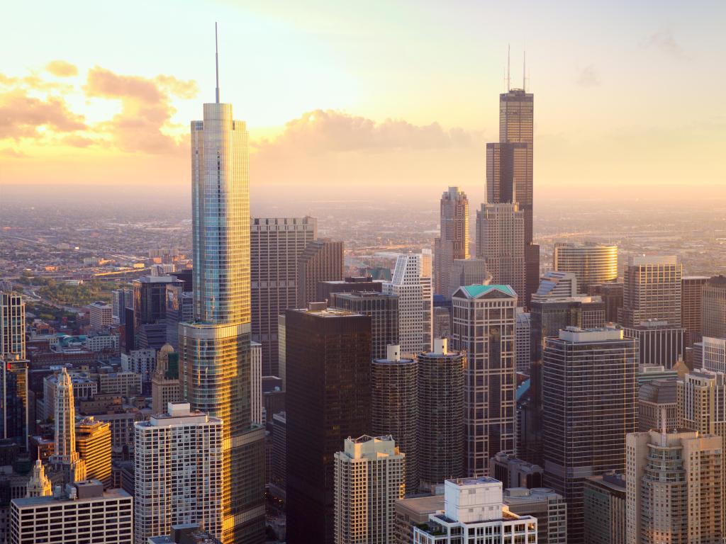 High rise buildings taken from a raised perspective with bright evening light illuminating them from the side