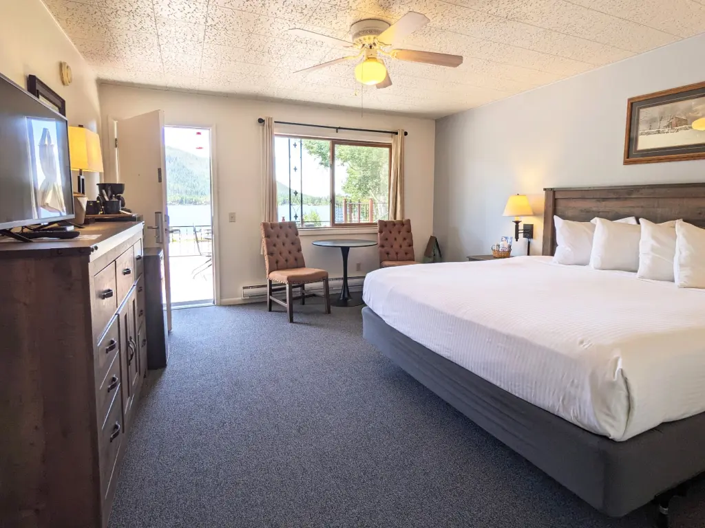 Simple interior of a motel room overlooking a lake