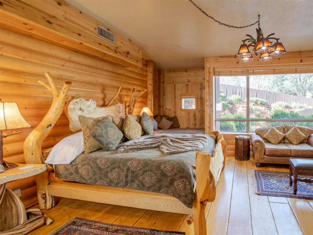 Elegant Whispering Pine bedroom with light-pine woodwork at Adobe Grand Villas