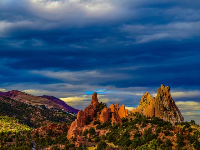 Garden of the Gods, Colorado Springs, at dusk with the rugged mountains in the background