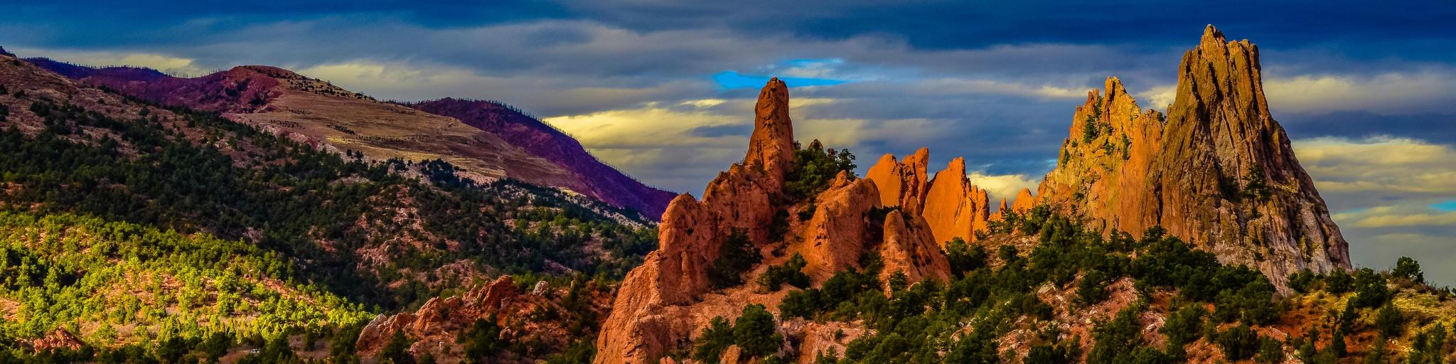 Garden of the Gods, Colorado Springs, at dusk with the rugged mountains in the background