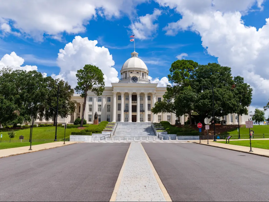 Montgomery, Alabama, USA with a view of the Alabama State Capitol building on a cloudy sunny day.