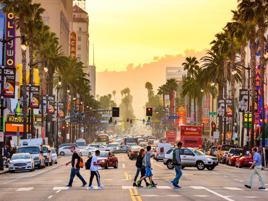 Hollywood Boulevard, Los Angeles, at dusk, with pedestrians crossing