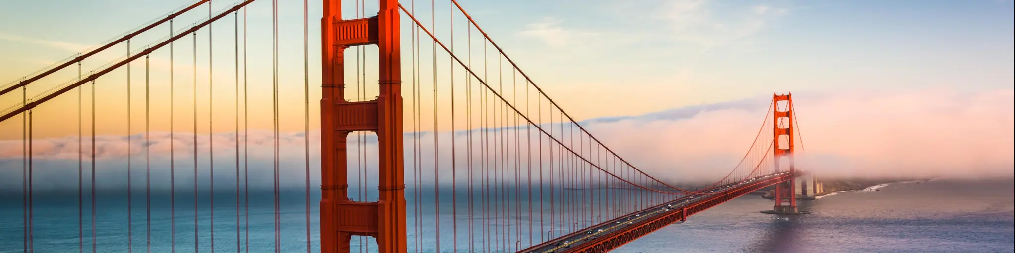 Sunset view of the Golden Gate Bridge and fog from Battery Spencer, Golden Gate National Recreation Area, in San Francisco, California.