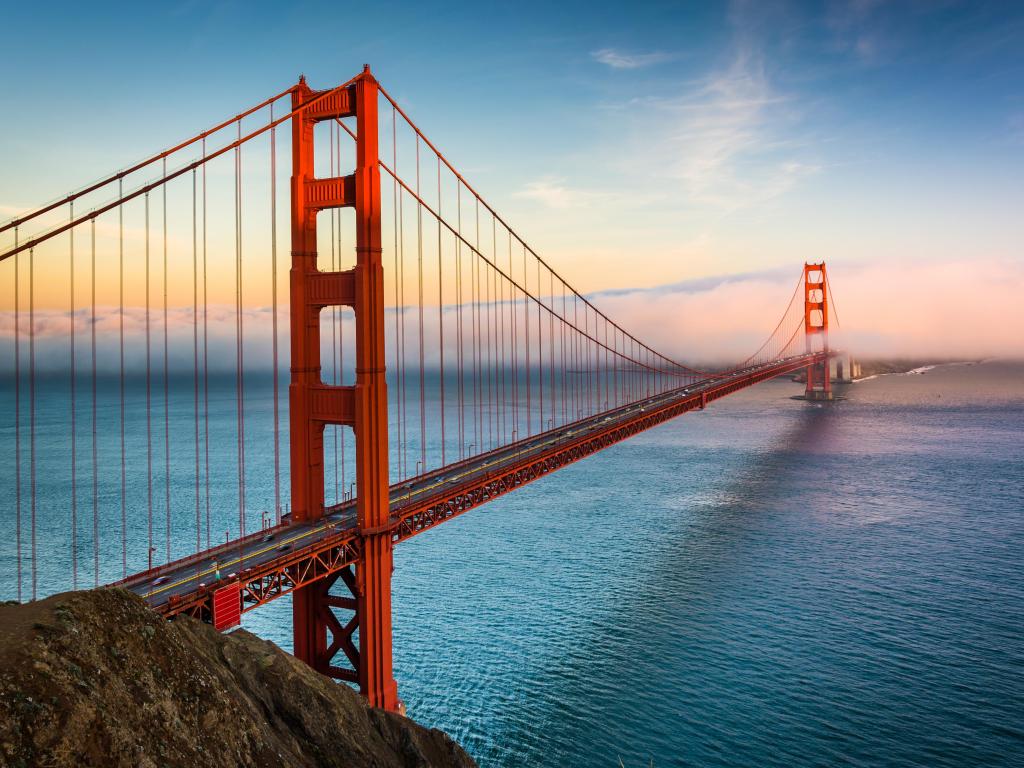 Sunset view of the Golden Gate Bridge and fog from Battery Spencer, Golden Gate National Recreation Area, in San Francisco, California.