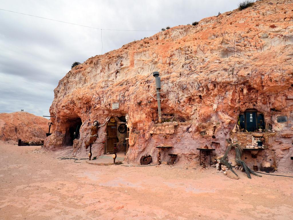 Coober Pedy, SA, Australia taken outside Crocodile Harry's underground home with cacophonous collection of art, decorations and messages.