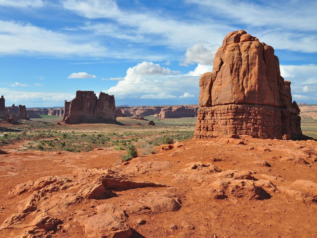 La Sal Mountain ViewPoint, Arches National Park, Moab, Utah, USA (Left to right) Three Gossips, Sheep Rock, Tower of Barbel, The Organ on a blue but cloudy day