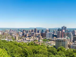 Panoramic skyline view from Mount Royal hill at the Montreal city
