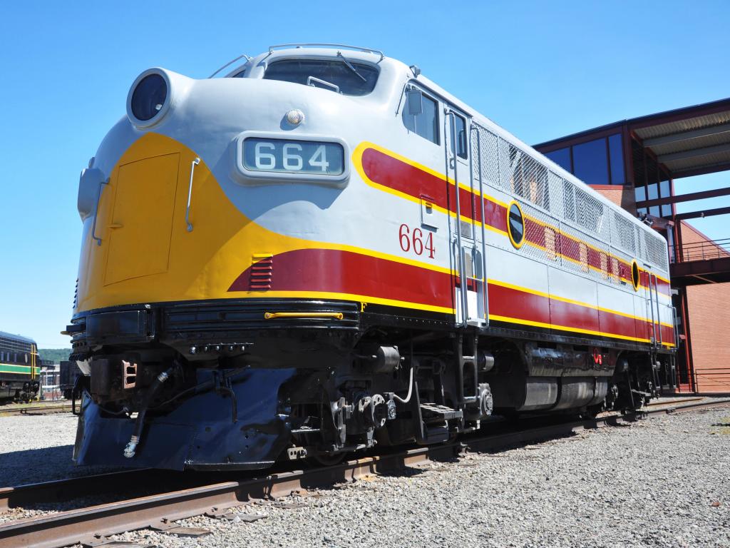 Yellow and red painted diesel Locomotive at Steamtown National Historic Site on a sunny day