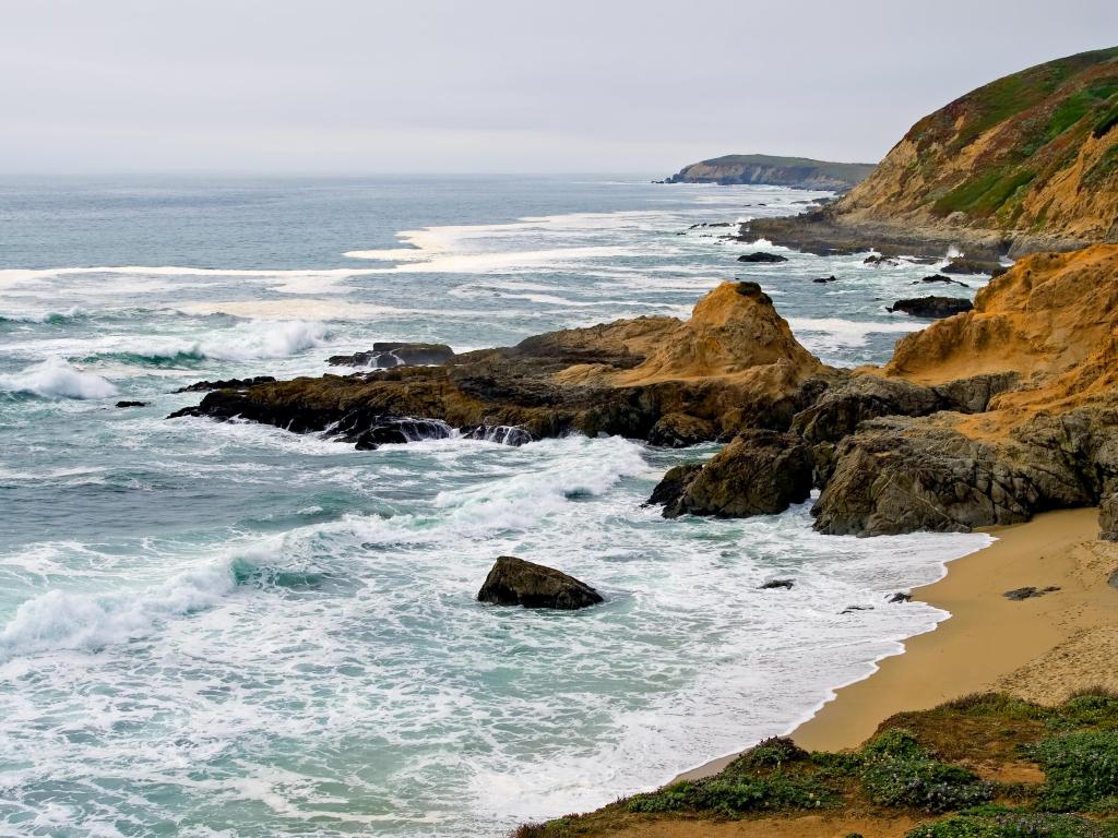 Bodega Bay, California, USA with a view of the coast and rocky cliffs.