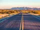 endless asphalt road with blue sky in Big Bend National Park, Texas, USA