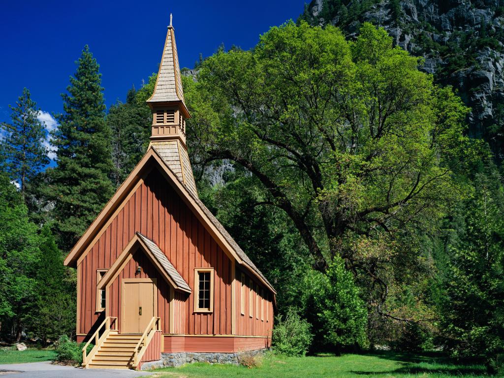 Small, charming chapel with a tower, surrounded by trees in Yosemite National Park