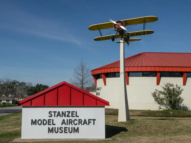 Building and sign of Stanzel Model Aircraft Museum on a sunny day