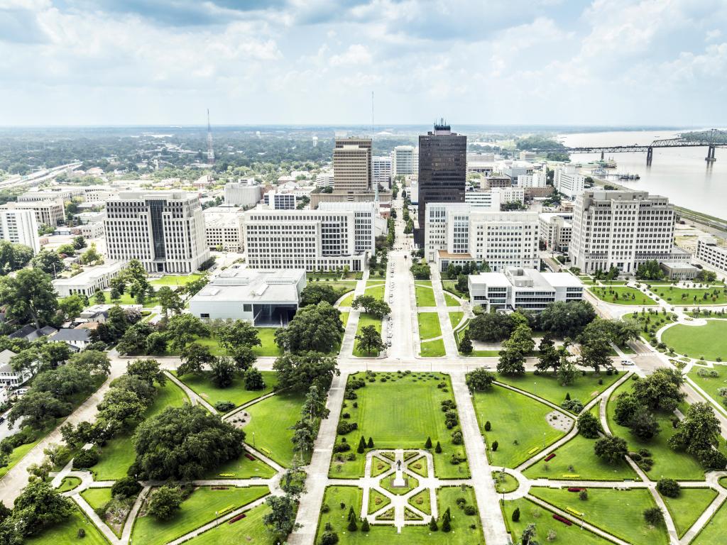 Baton Rouge, US showing an aerial view of the city with the famous skyline and a beautiful park in the foreground.