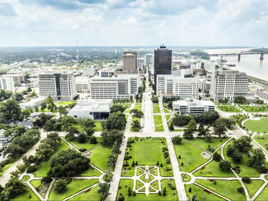 Baton Rouge, US showing an aerial view of the city with the famous skyline and a beautiful park in the foreground.