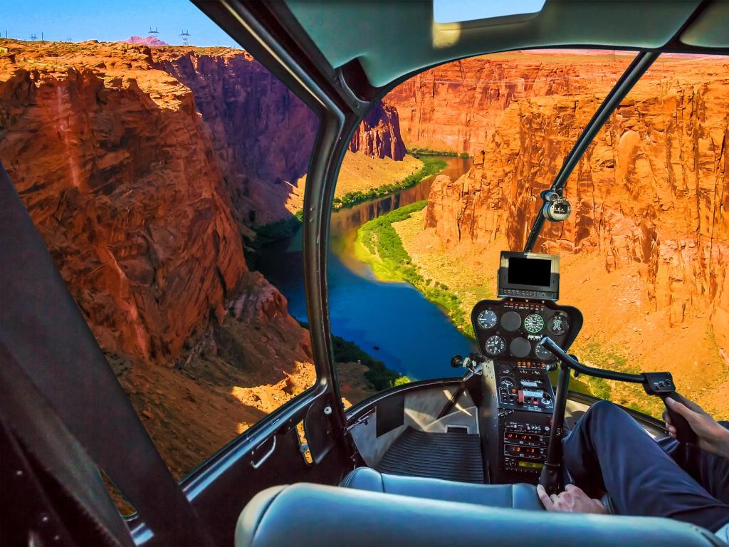 Helicopter cockpit with pilot arm and control console inside the cabin on the Grand Canyon Lake Powell. Reserve on the Colorado River