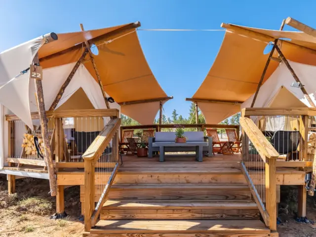 View of outside terrace and seating of the luxury glamping tent at Under Canvas Bryce Canyon, Utah