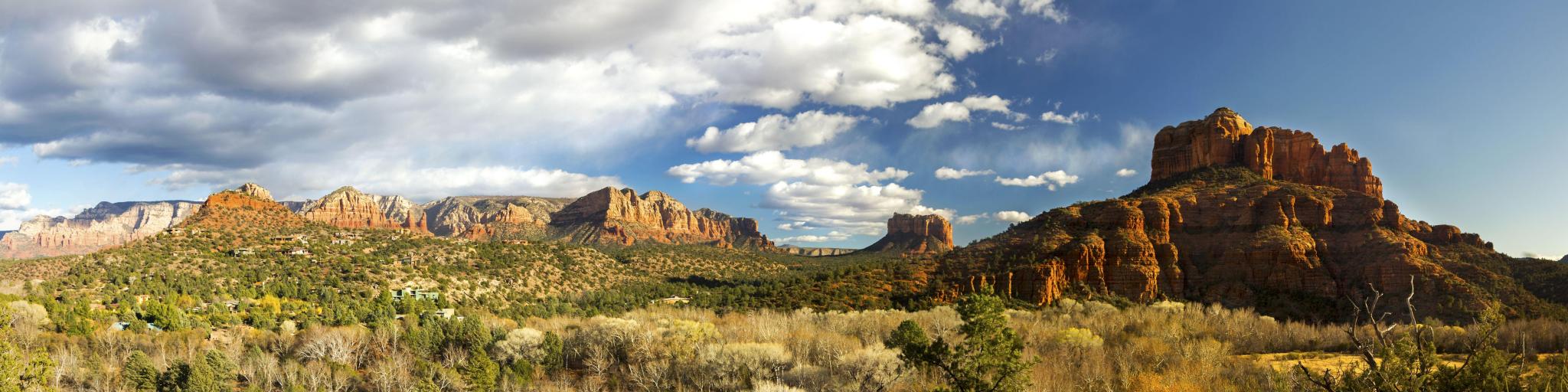 Wide Panoramic Scenic Landscape of Cathedral Mountain and Red Rock State Park under dramatic winter sky in Sedona Arizona