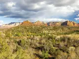 Wide Panoramic Scenic Landscape of Cathedral Mountain and Red Rock State Park under dramatic winter sky in Sedona Arizona
