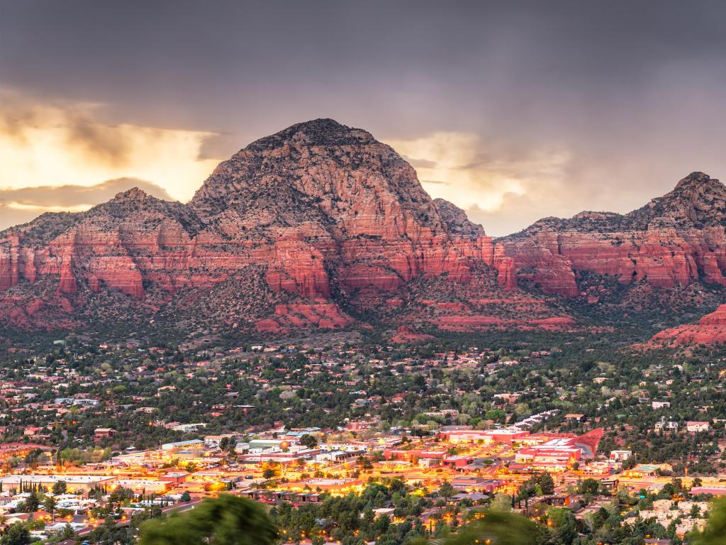 Sedona, Arizona, USA downtown cityscape and mountains in the distance.
