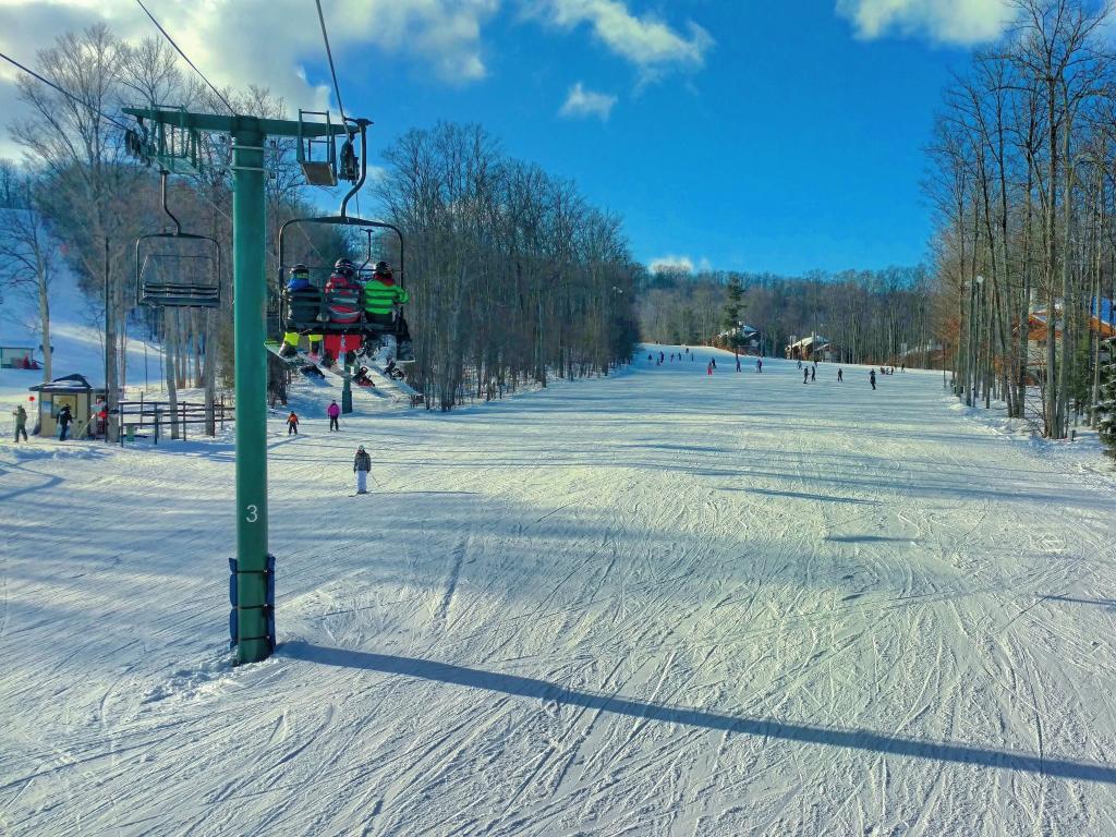 Skiers on the Boyneland Lift at Boyne Mountain in Northern Michigan.