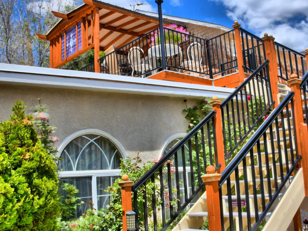 Steps leading up to wooden terrace and tables at Bard's Inn, Cedar City