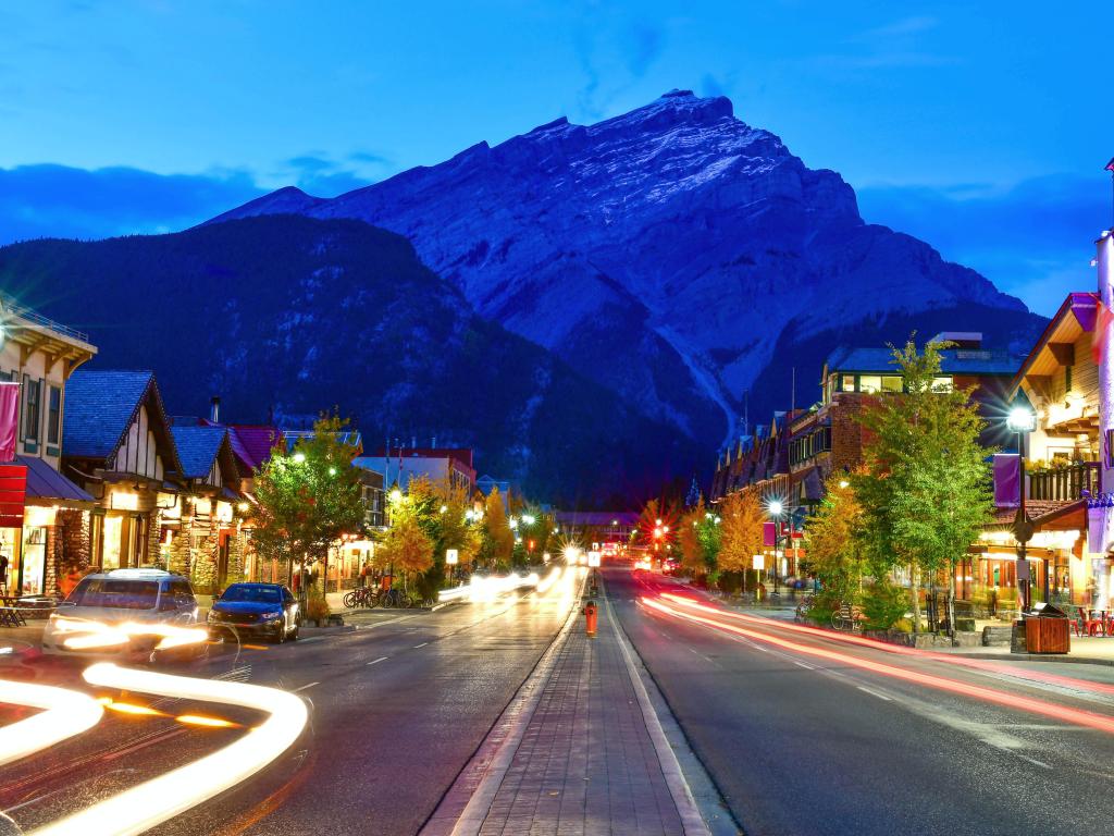 Street view of famous Banff Avenue at twilight time. Banff is a resort town and one of Canada's most popular tourist destinations.