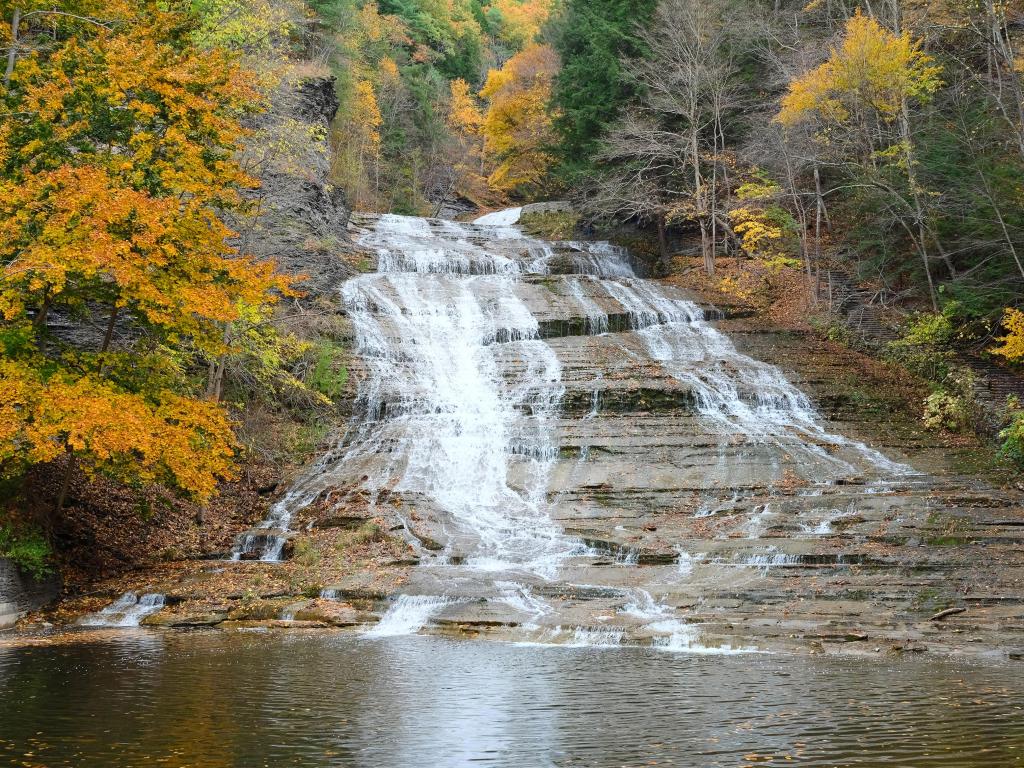Autumn landscape with beautiful waterfalls on a stone cliff